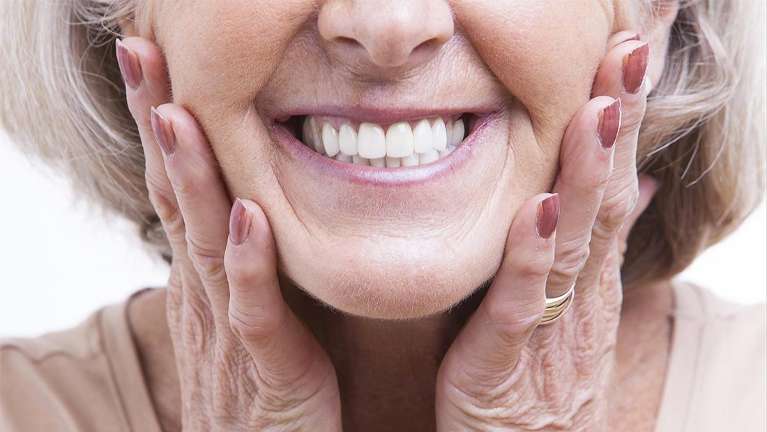 woman touches her face