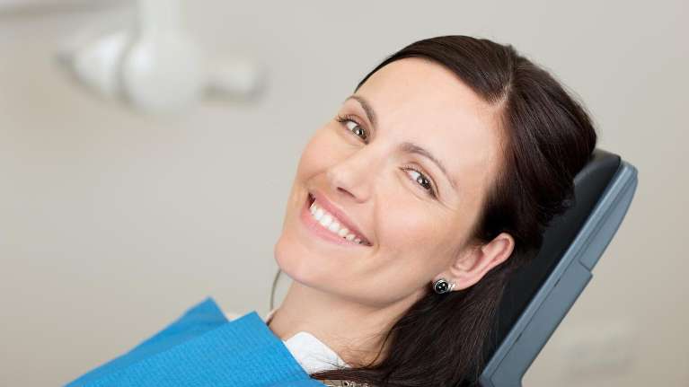 A woman with a bright smile on her face