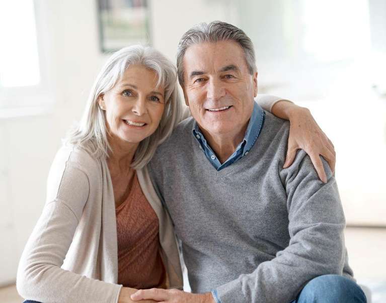 senior couple smiling with their partial dentures in Rehoboth Beach DE 