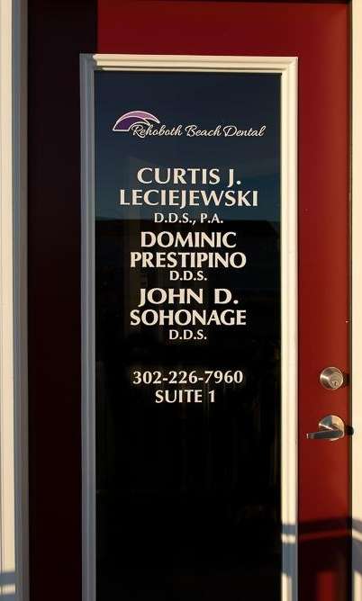 Front door of Rehoboth Beach Dental with signage